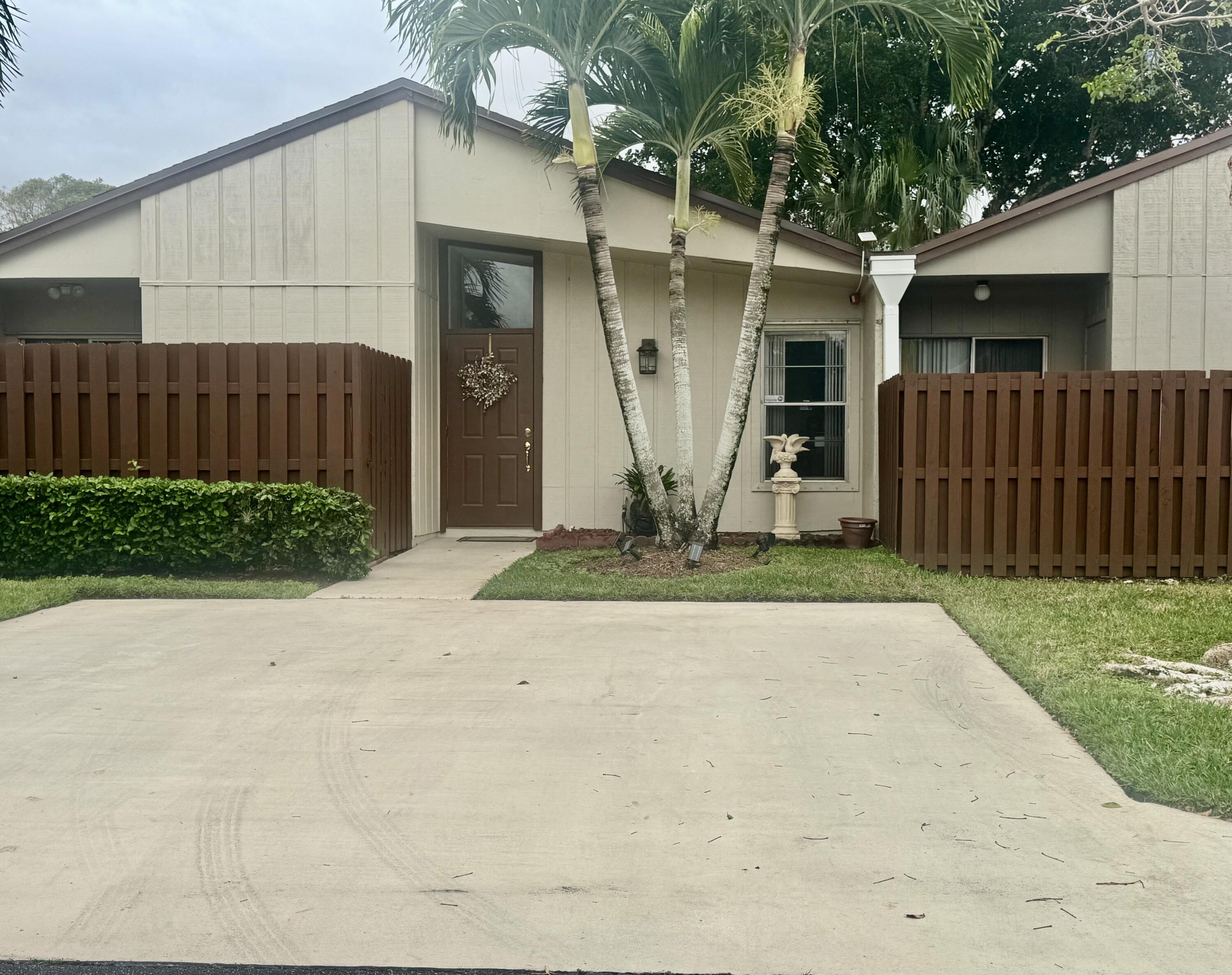 a front view of a house having yard