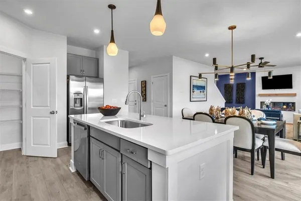 a kitchen with a sink cabinets and window