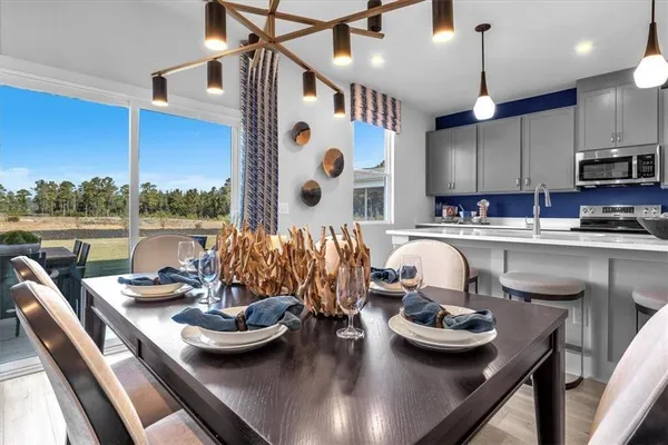 a kitchen with furniture and view of kitchen
