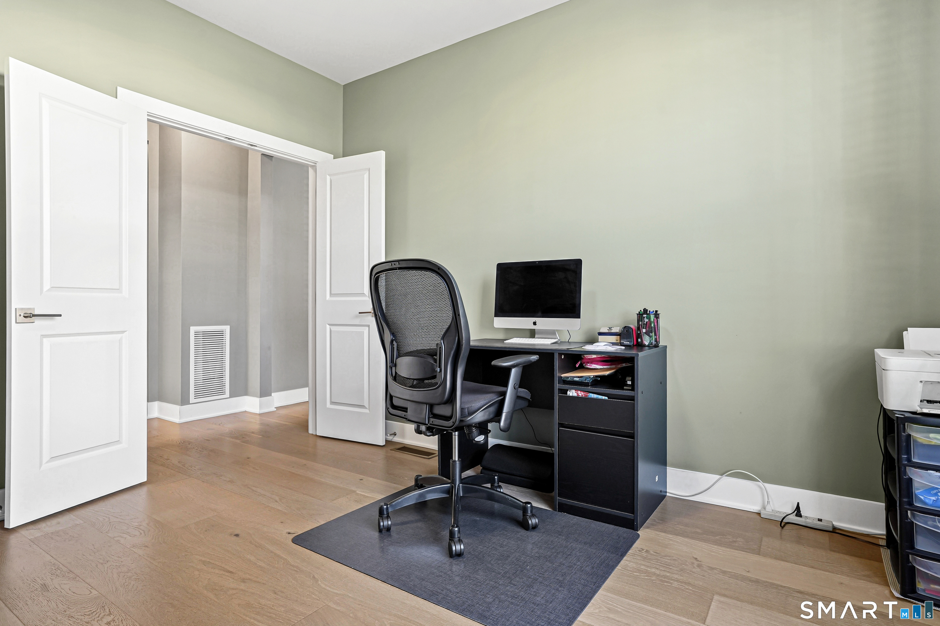 19 Enclave Circle, Unit 19 Newtown, CT 06470 - Photo 22 of 39 a view of a workspace with furniture and wooden floor