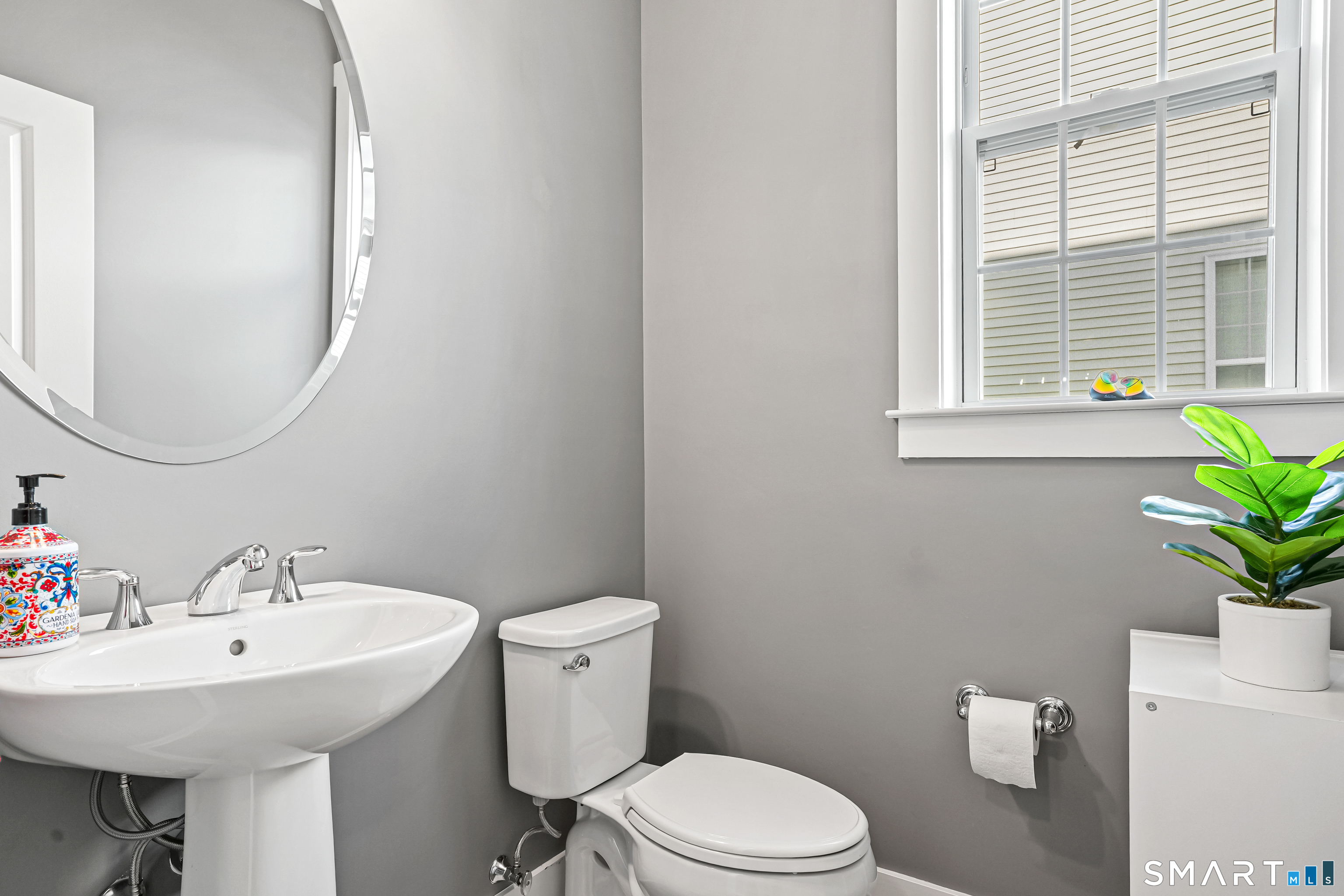 19 Enclave Circle, Unit 19 Newtown, CT 06470 - Photo 23 of 39 a white toilet sitting next to a white sink