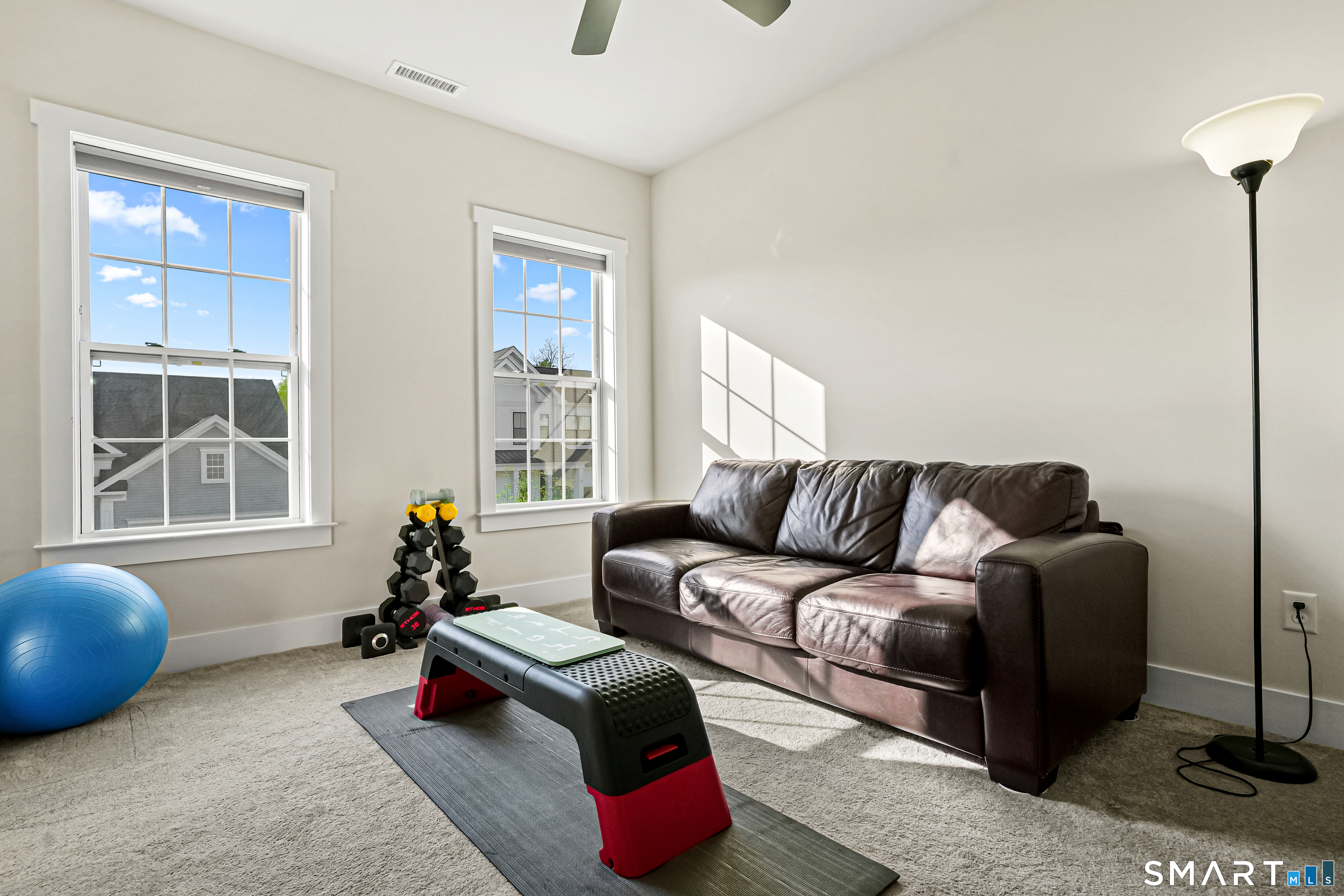 19 Enclave Circle, Unit 19 Newtown, CT 06470 - Photo 28 of 39 a living room with furniture and a window