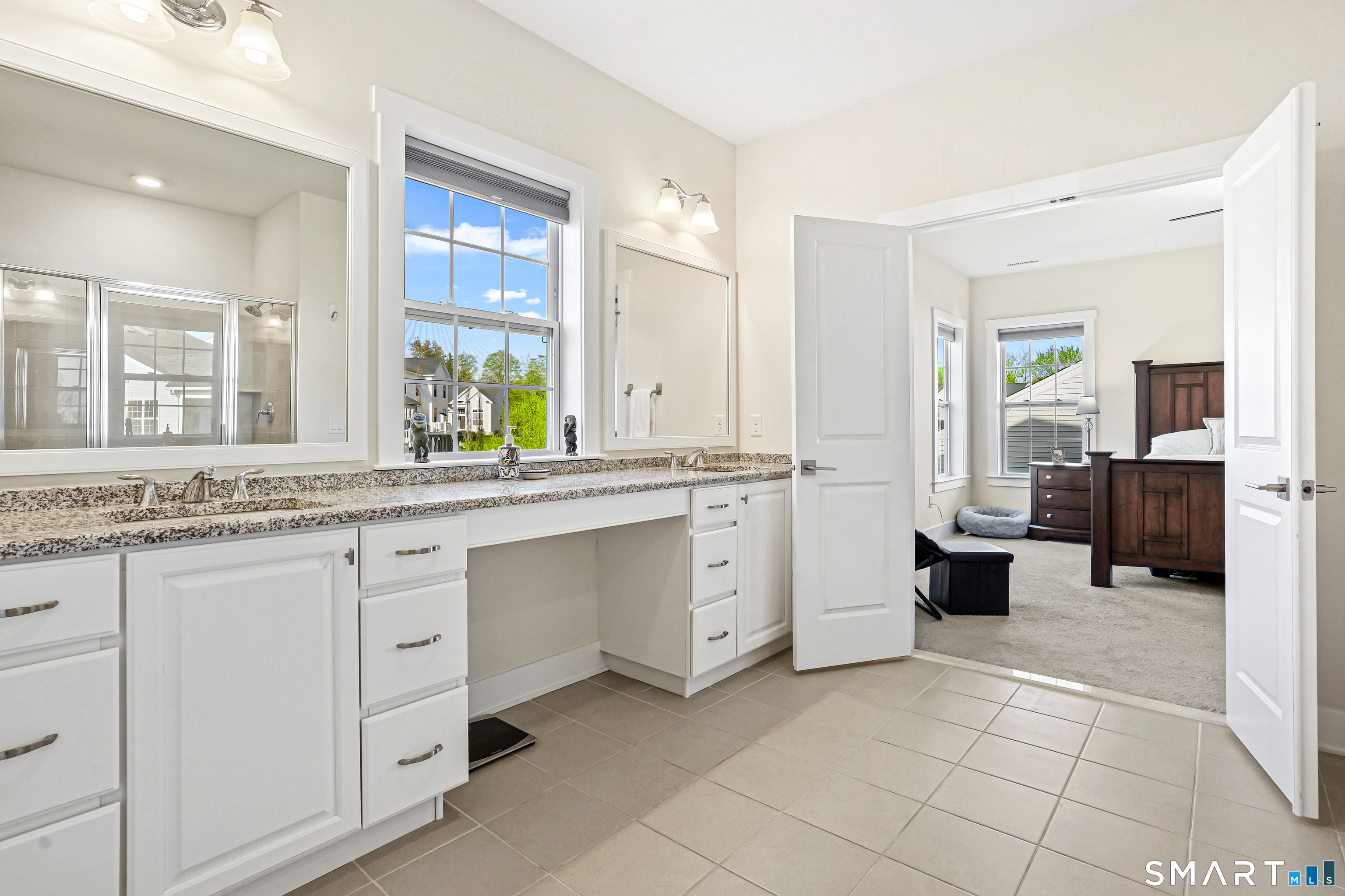 19 Enclave Circle, Unit 19 Newtown, CT 06470 - Photo 31 of 39 a spacious en suite bathroom with a double vanity sink a mirror and a bathtub