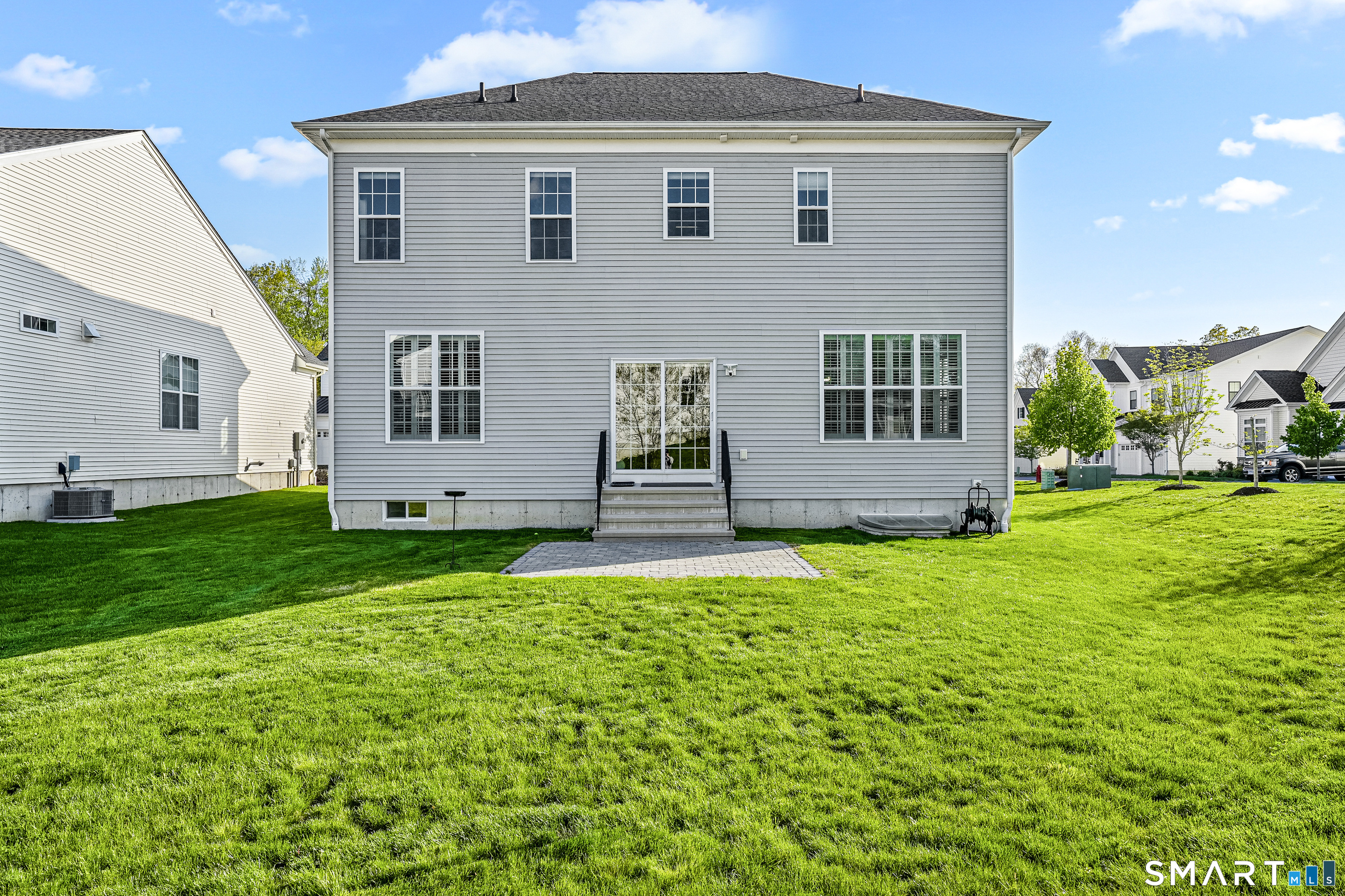 19 Enclave Circle, Unit 19 Newtown, CT 06470 - Photo 39 of 39 a front view of a house with a garden