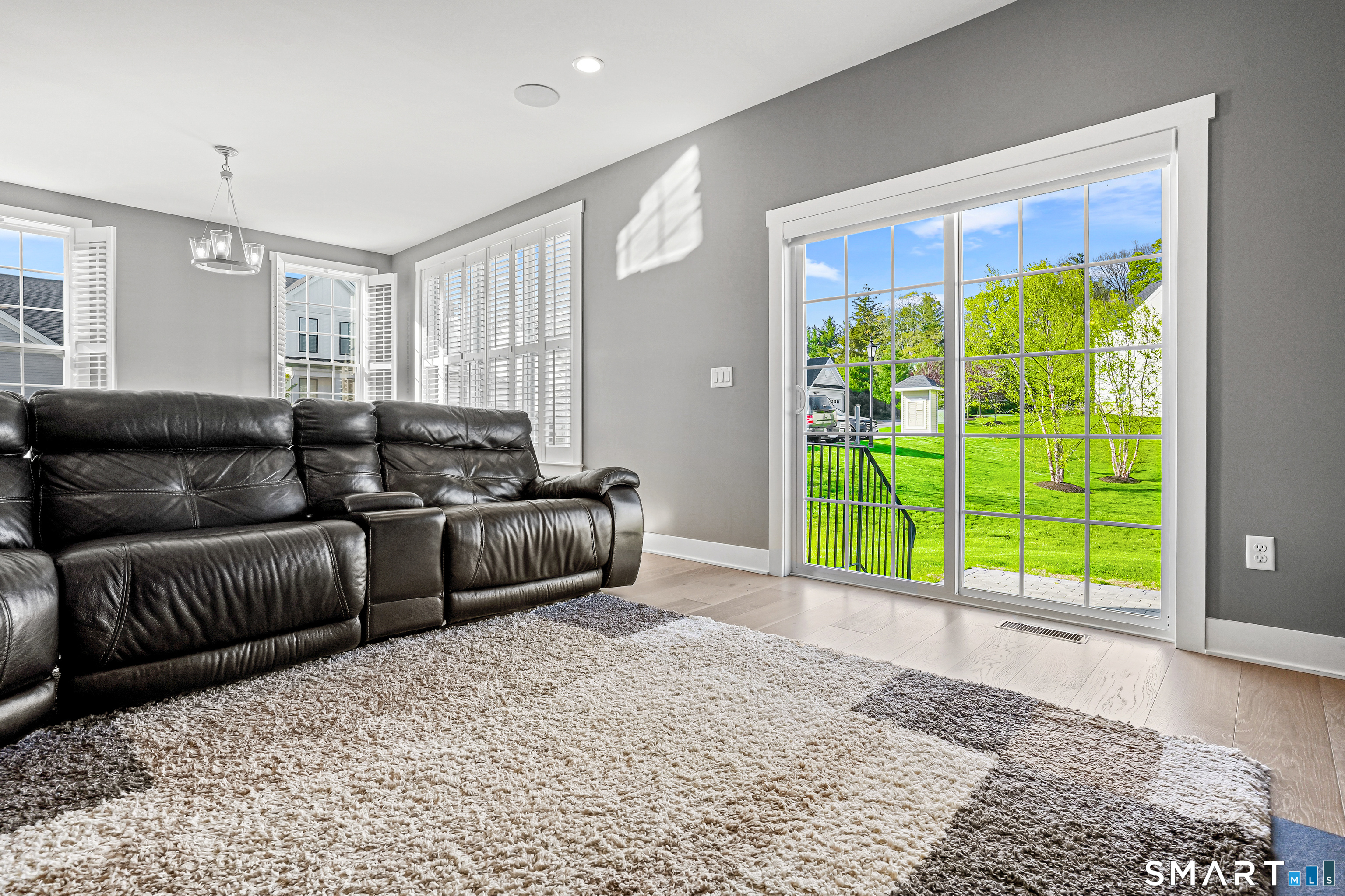 19 Enclave Circle, Unit 19 Newtown, CT 06470 - Photo 4 of 39 a living room with furniture and a large window
