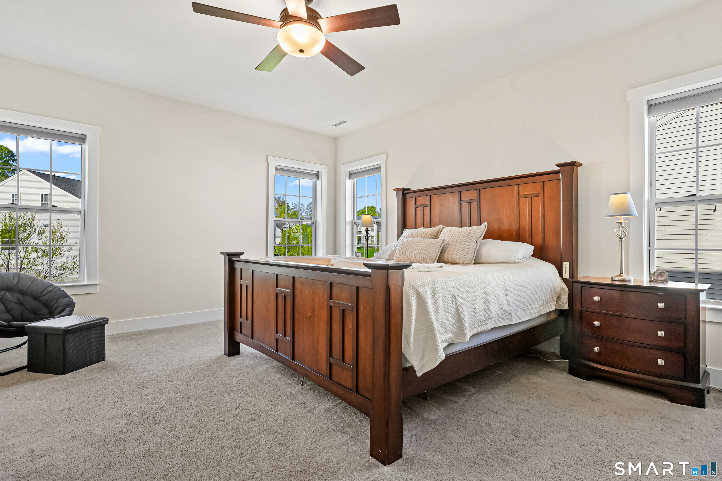 19 Enclave Circle, Unit 19 Newtown, CT 06470 - Photo 6 of 39 a bedroom with a bed and a chandelier