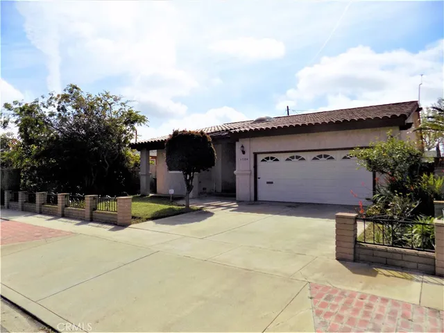 a view of a house with patio and sitting area