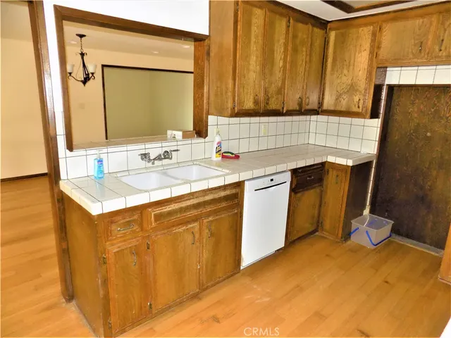 a kitchen with a sink stove and cabinets