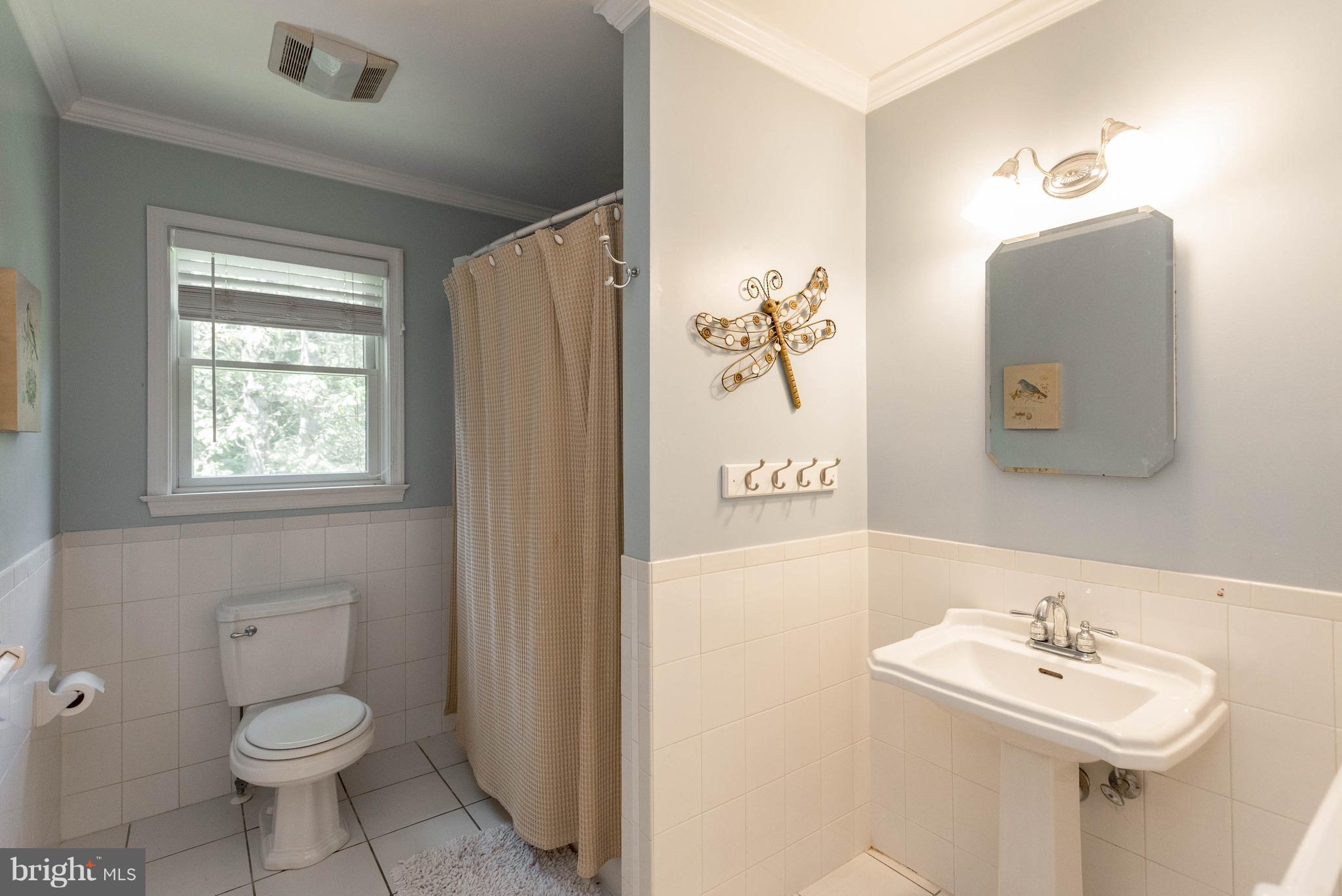 1158 Quarry Road Pylesville, MD 21132 - Photo 16 of 30 a bathroom with a toilet sink and mirror