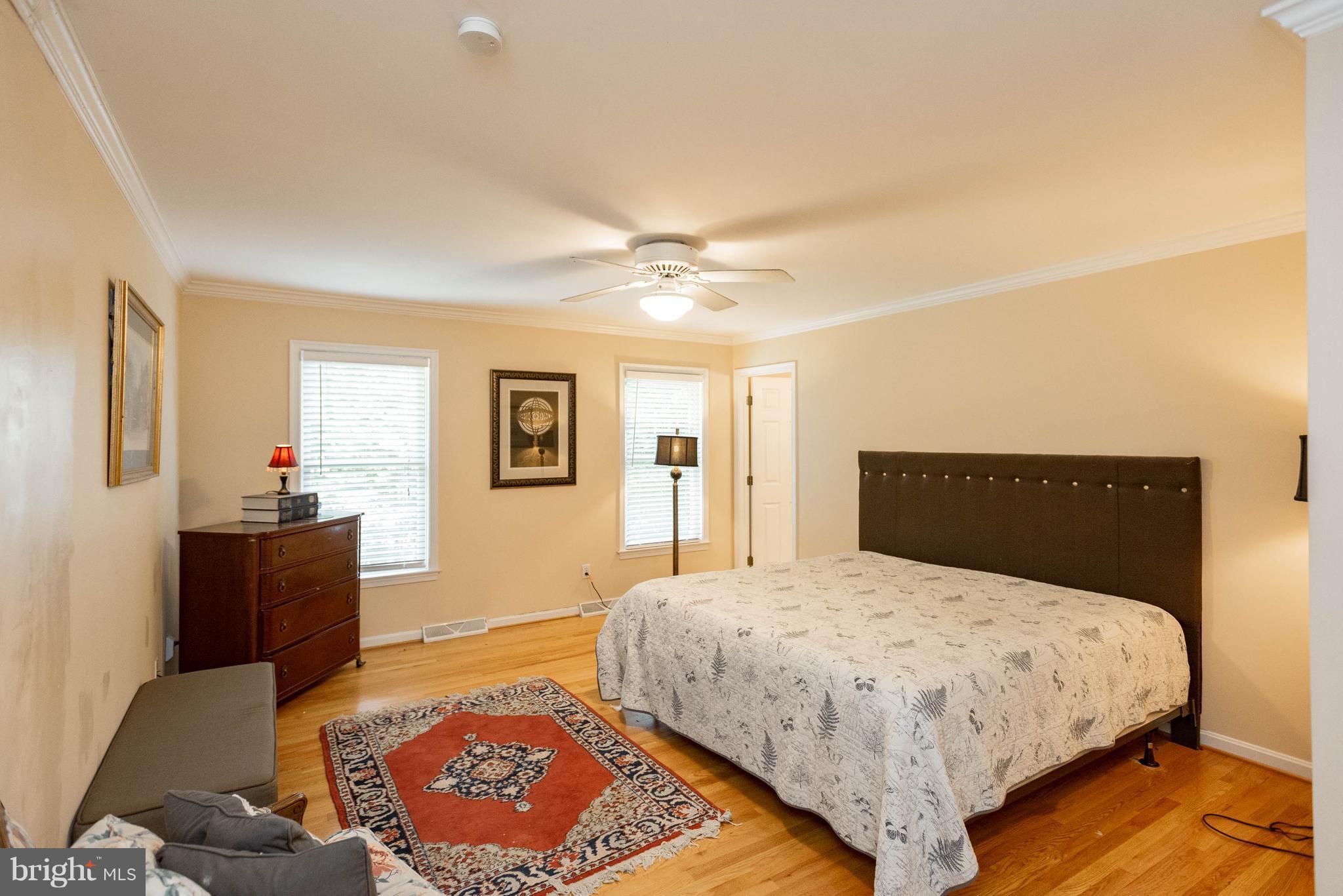 1158 Quarry Road Pylesville, MD 21132 - Photo 18 of 30 a bedroom with a large bed and a chandelier