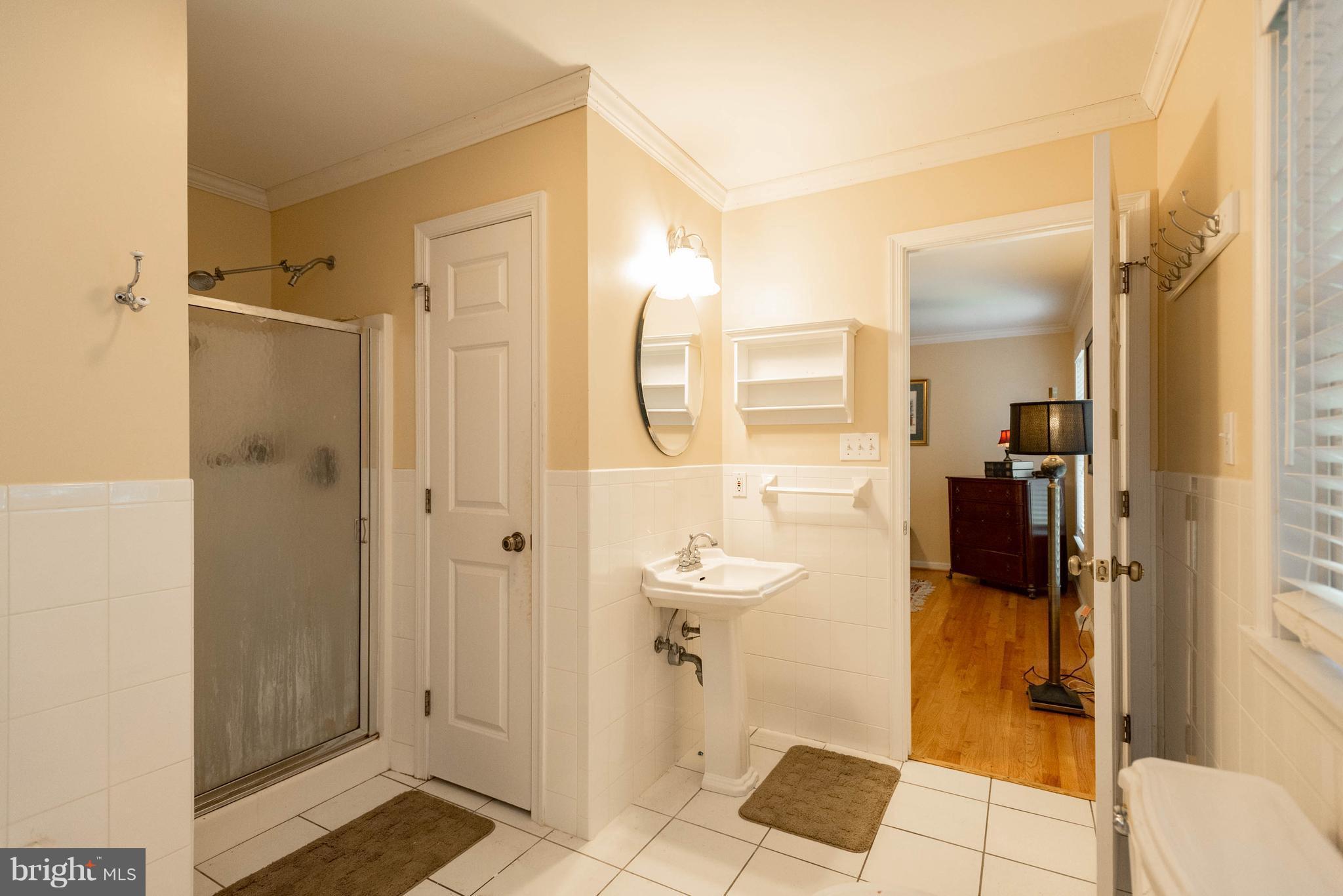1158 Quarry Road Pylesville, MD 21132 - Photo 20 of 30 a bathroom with a glass shower door