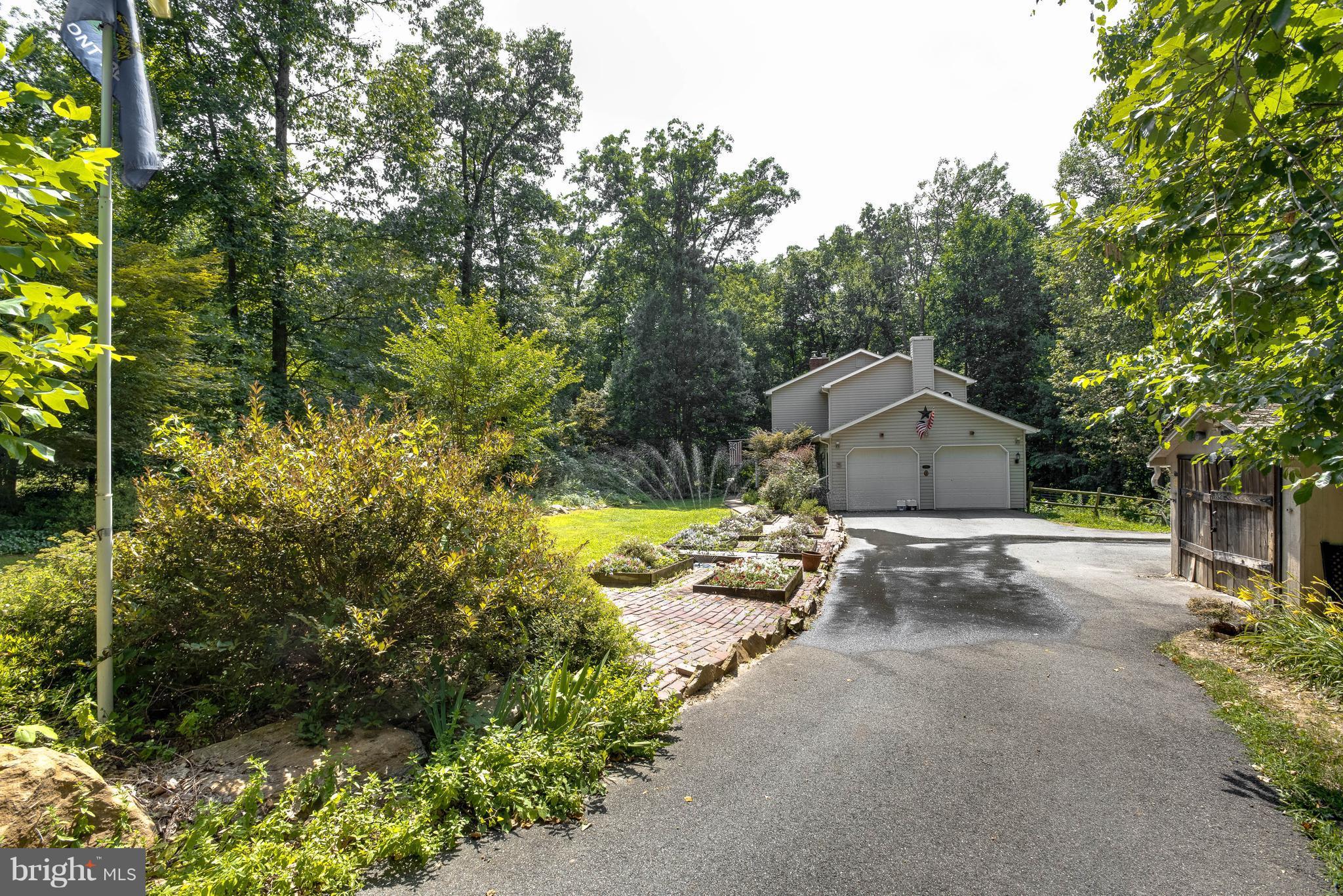 1158 Quarry Road Pylesville, MD 21132 - Photo 29 of 30 a view of a house with a big yard and large trees