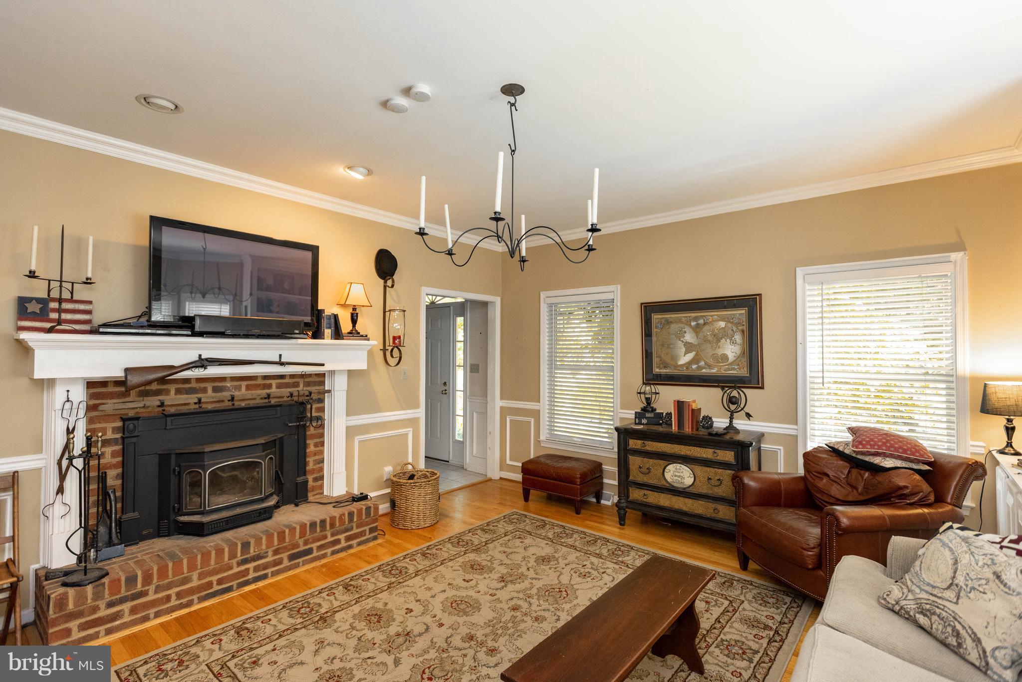 1158 Quarry Road Pylesville, MD 21132 - Photo 7 of 30 a living room with furniture a fireplace and a flat screen tv