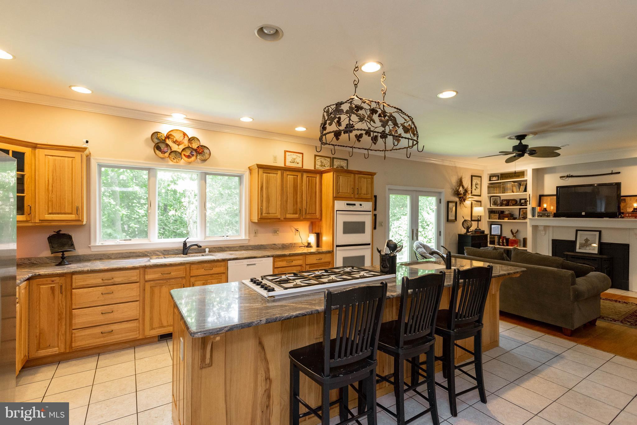 1158 Quarry Road Pylesville, MD 21132 - Photo 10 of 30 a kitchen with stainless steel appliances granite countertop a stove and a view of living room