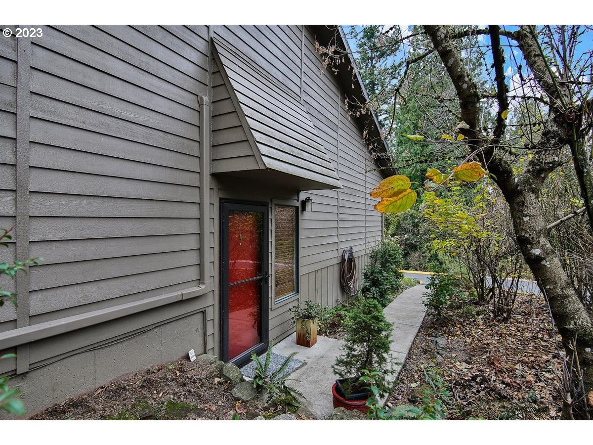 3851 Southwest Canby Street Portland, OR 97219 - Photo 1 of 32 a view of a house with a backyard