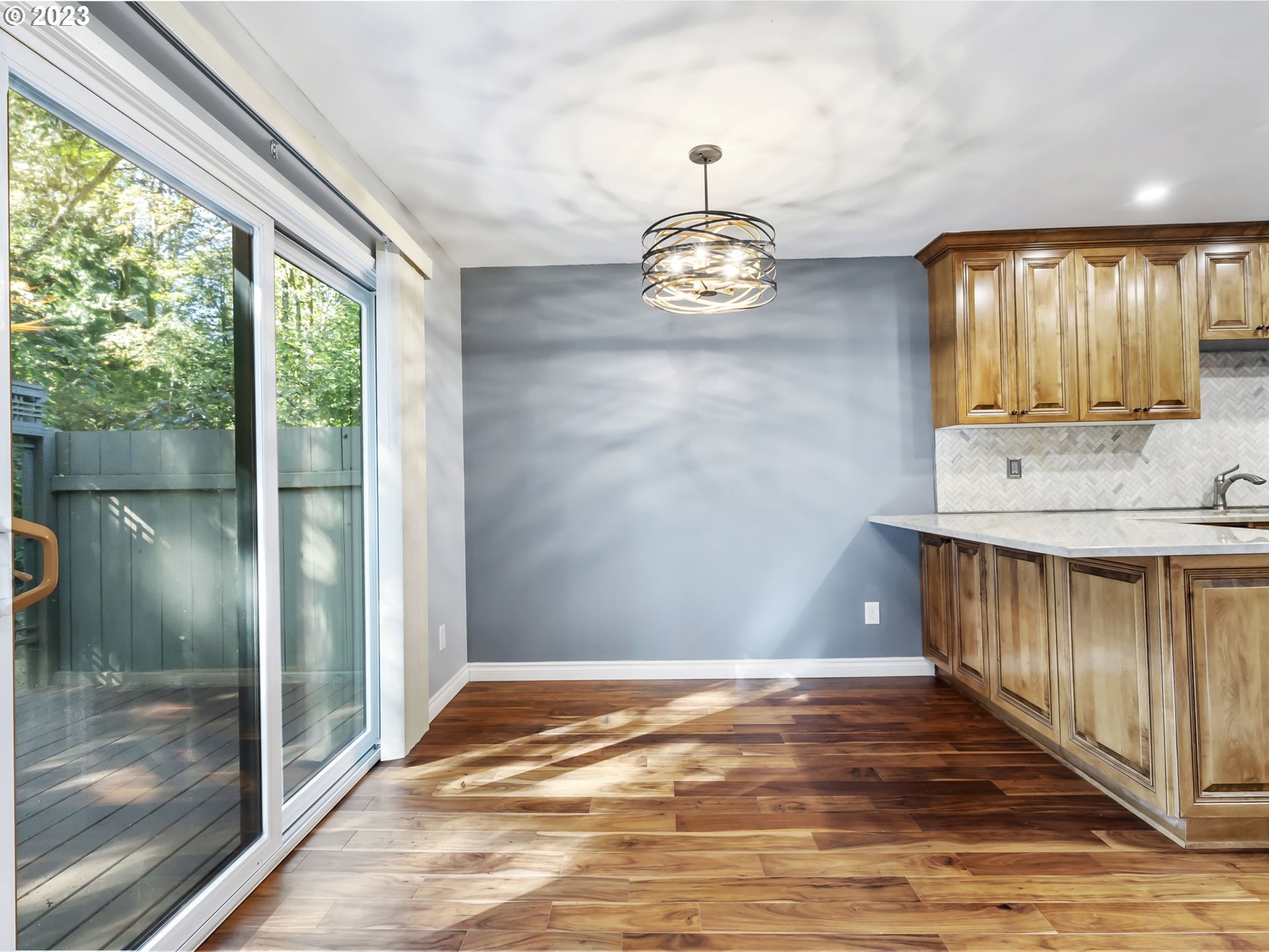 3851 Southwest Canby Street Portland, OR 97219 - Photo 14 of 32 a view of a room with wooden floor and outdoor space