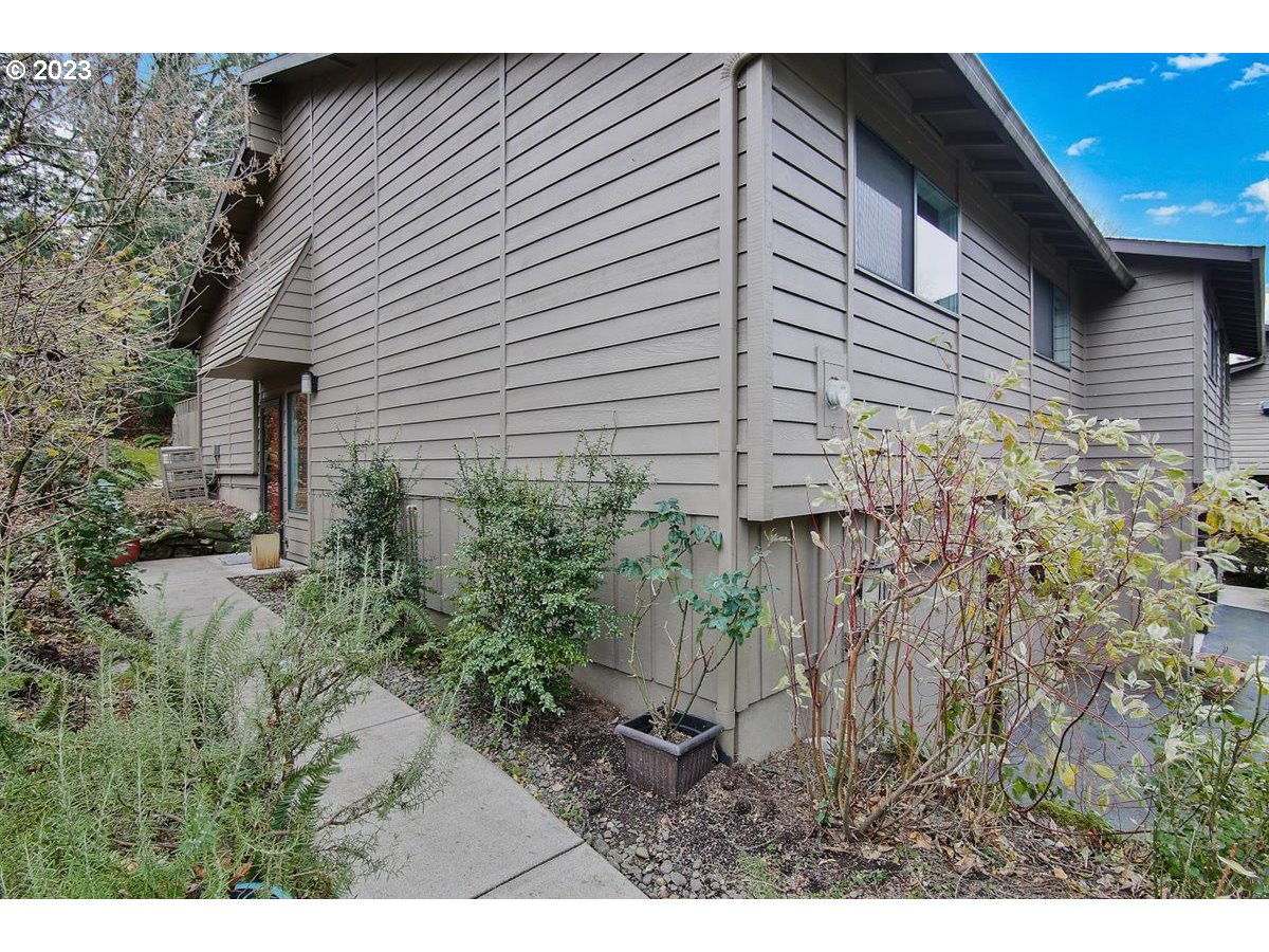 3851 Southwest Canby Street Portland, OR 97219 - Photo 2 of 32 a view of a backyard of the house