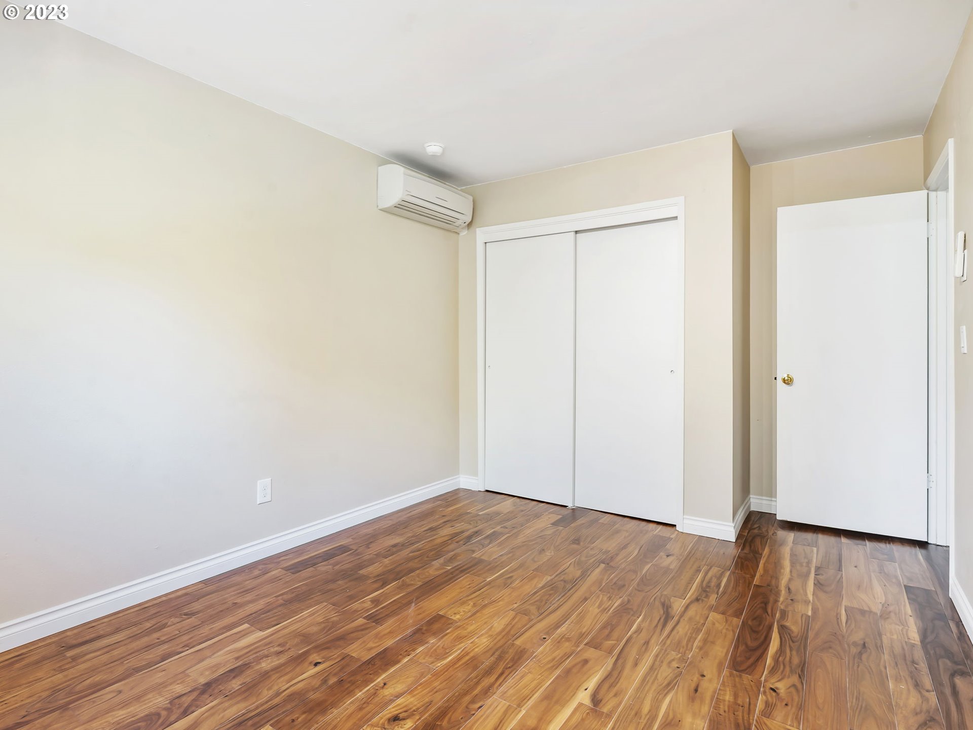 3851 Southwest Canby Street Portland, OR 97219 - Photo 21 of 32 a view of empty room with wooden floor