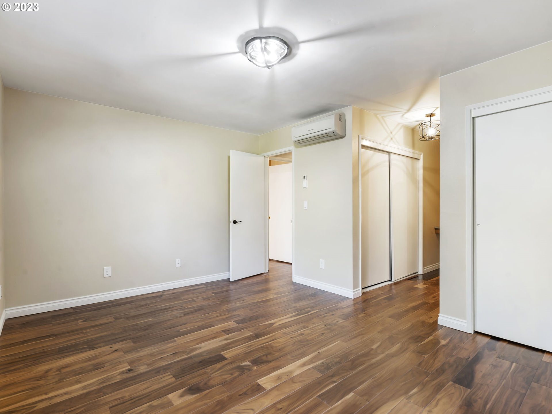3851 Southwest Canby Street Portland, OR 97219 - Photo 23 of 32 a view of an empty room with wooden floor