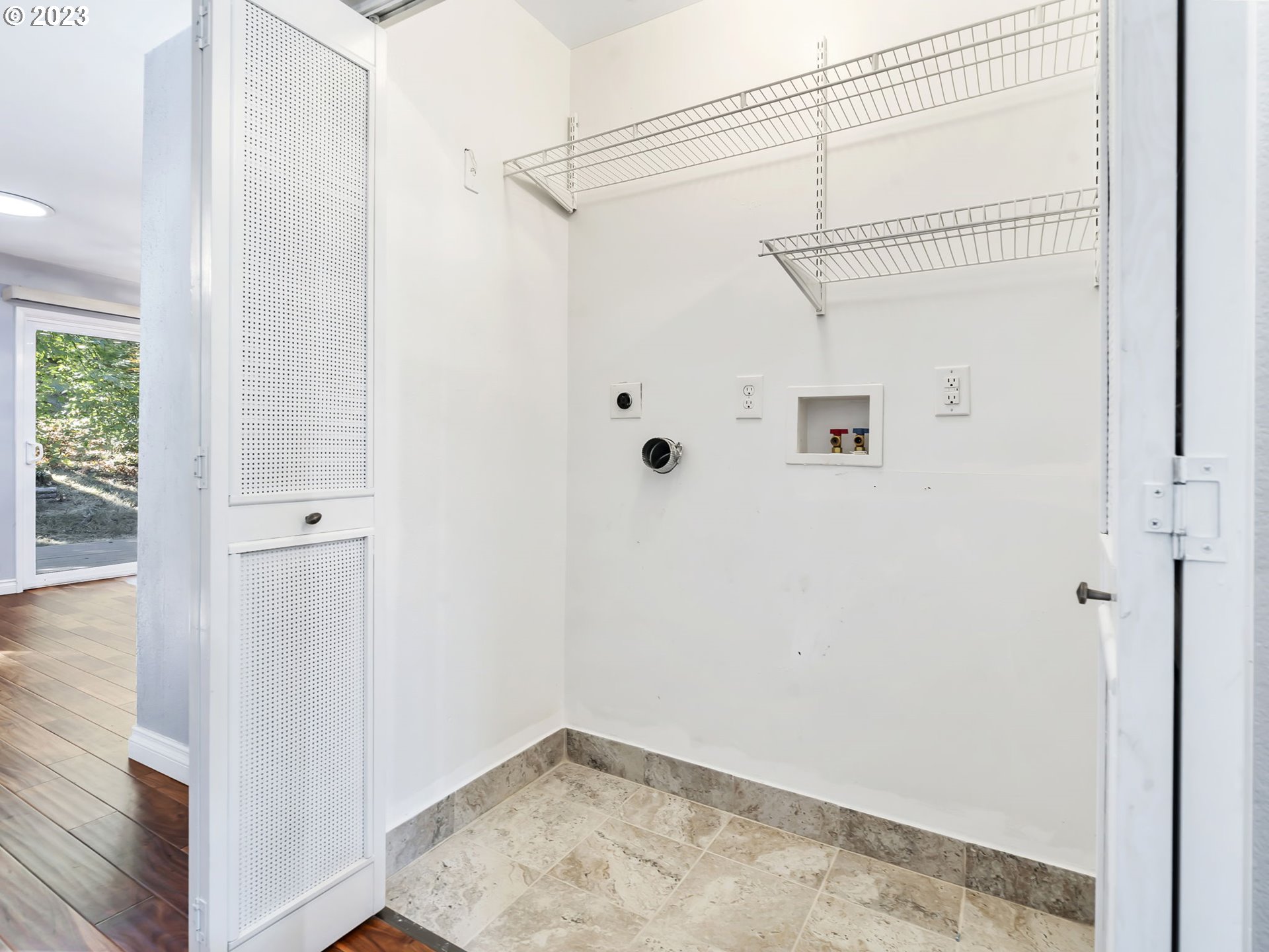 3851 Southwest Canby Street Portland, OR 97219 - Photo 28 of 32 a view of a small space with wooden floor