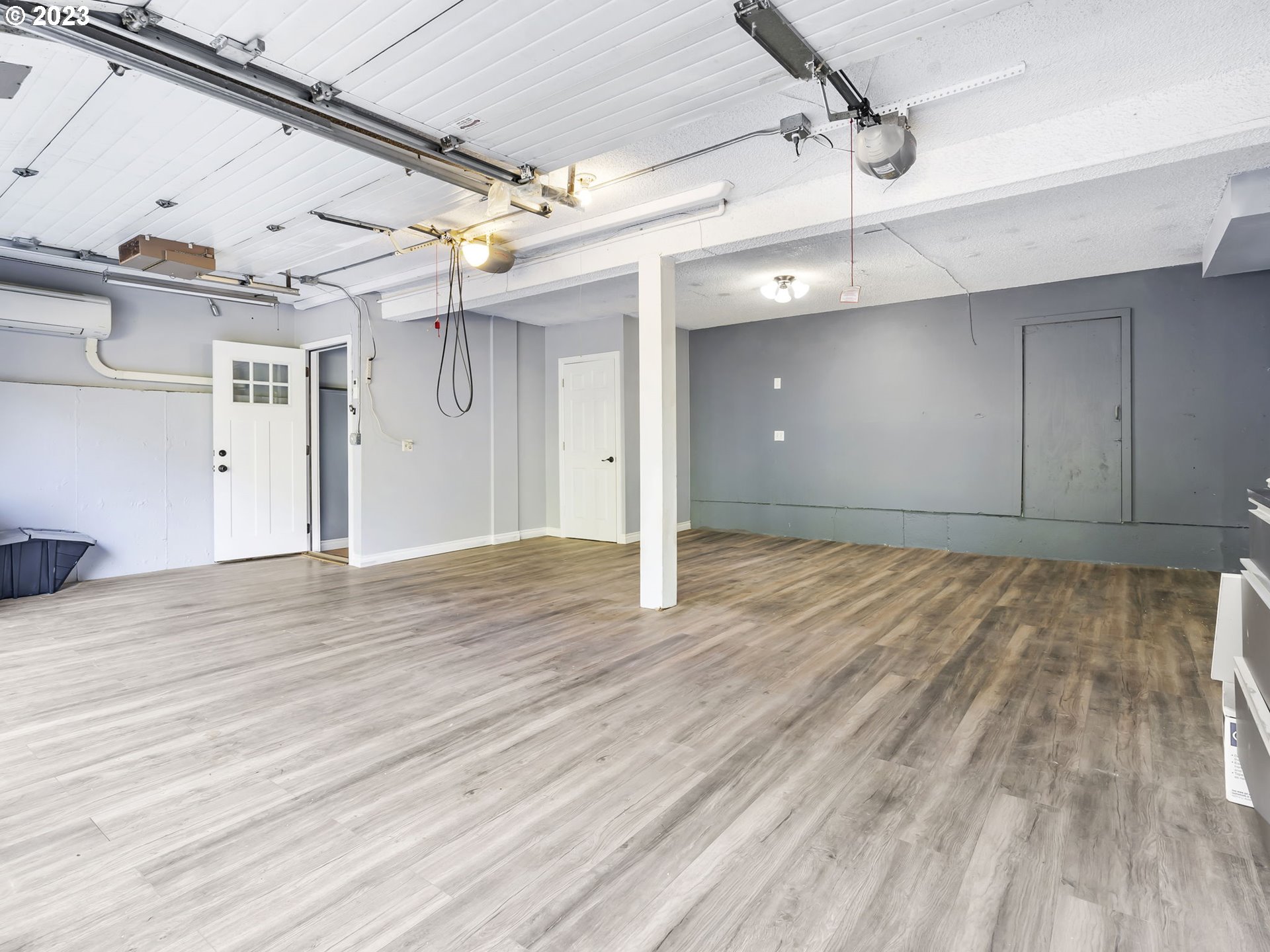 3851 Southwest Canby Street Portland, OR 97219 - Photo 30 of 32 a view of a room with wooden floor