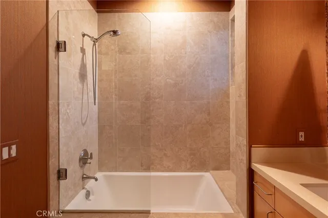 a bathroom with a tub and shower