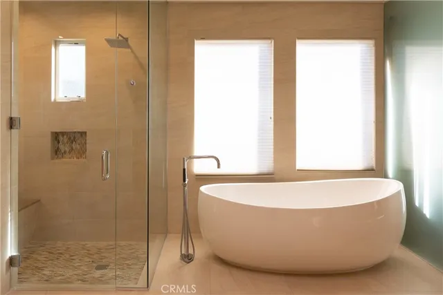 a white bath tub sitting in a bathroom