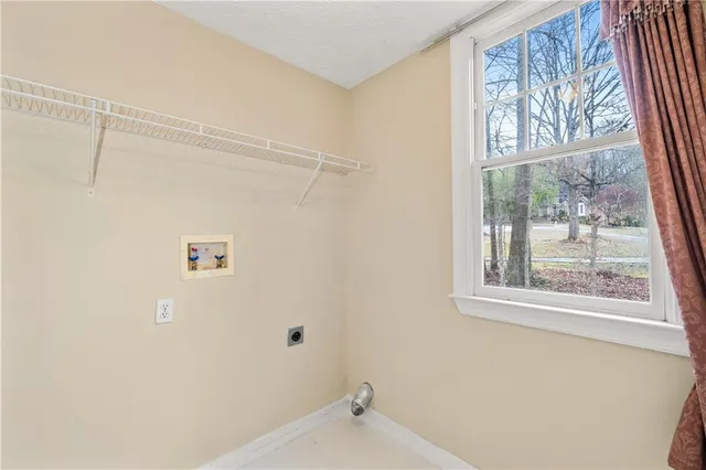 a bathroom with a shower and a window