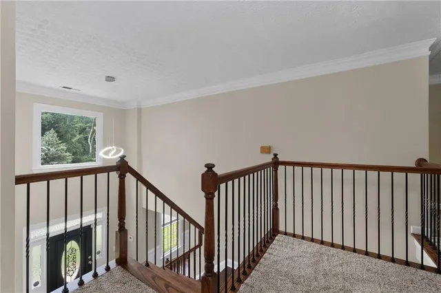 a bath tub sitting next to a white sink and a toilet