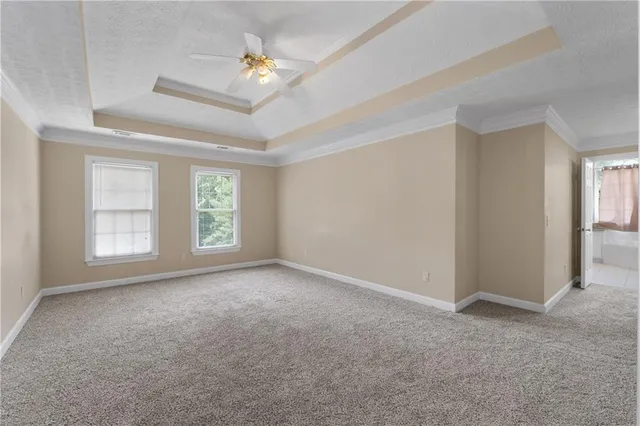 an empty room with a fireplace and window