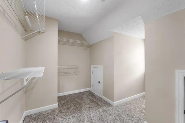 a bathroom with a granite countertop tub and a sink