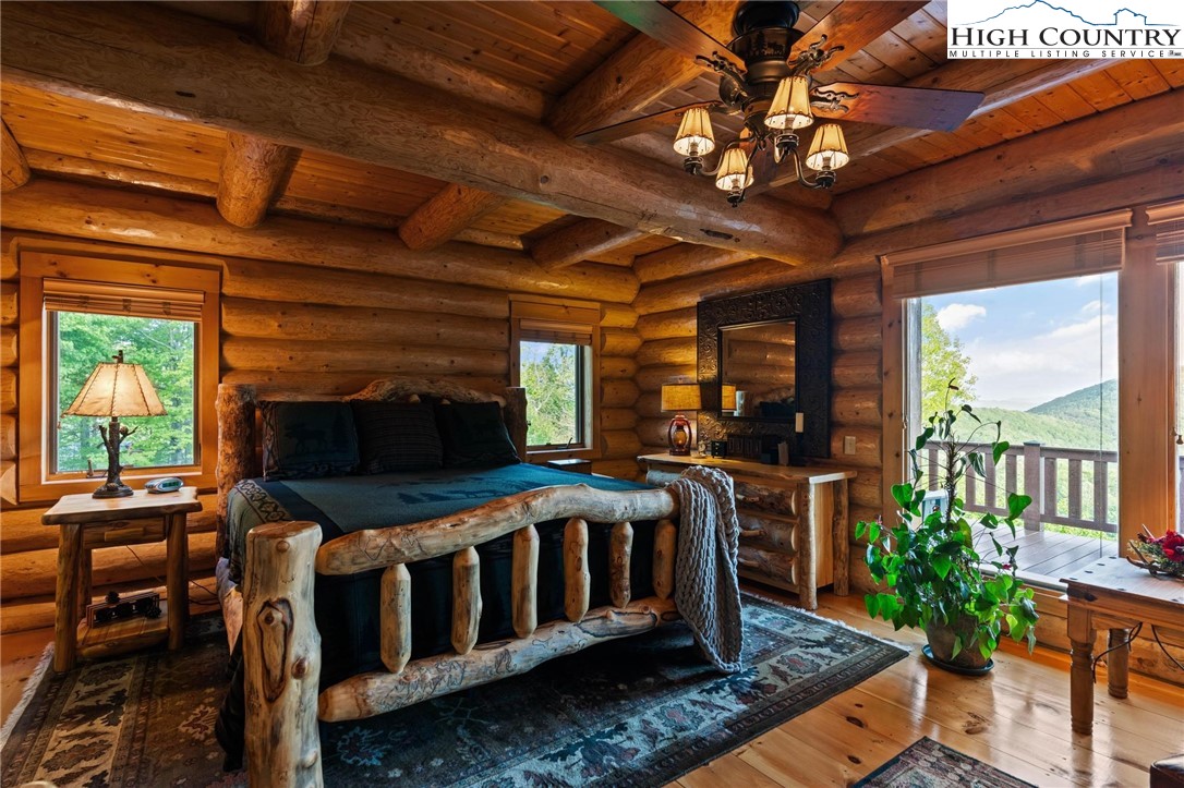 405 Elk Summit Drive Todd, NC 28684 - Photo 16 of 50 a bedroom with furniture window and a rug