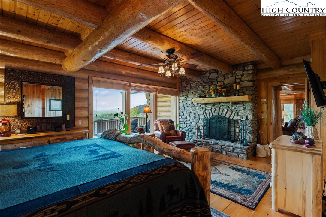 405 Elk Summit Drive Todd, NC 28684 - Photo 17 of 50 a bedroom with furniture and a flat screen tv