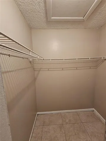 a view of a room with racks on the wall