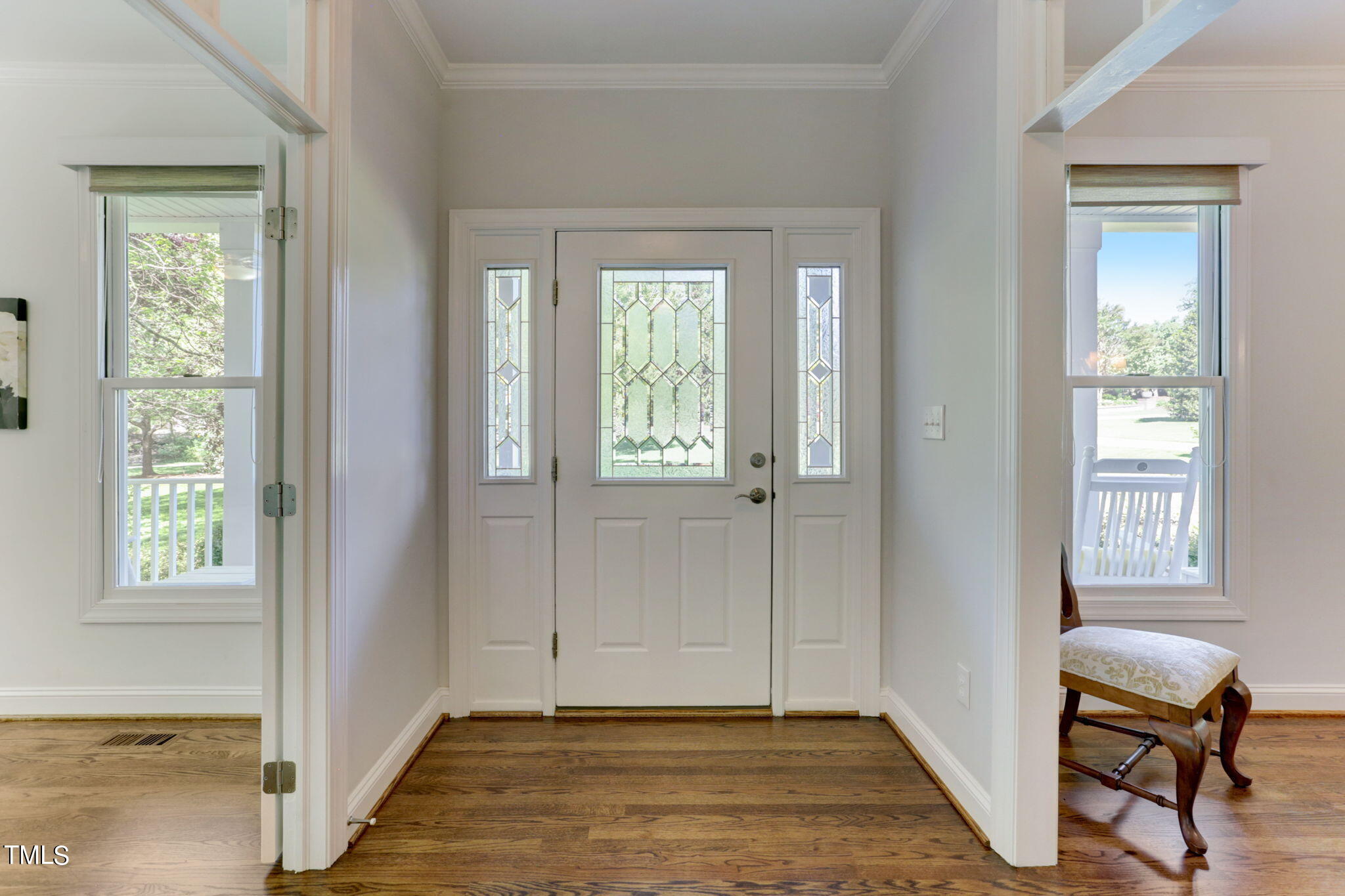 1029 Sunset Meadows Drive Apex, NC 27523 - Photo 13 of 52 a view of an entryway with wooden floor and windows
