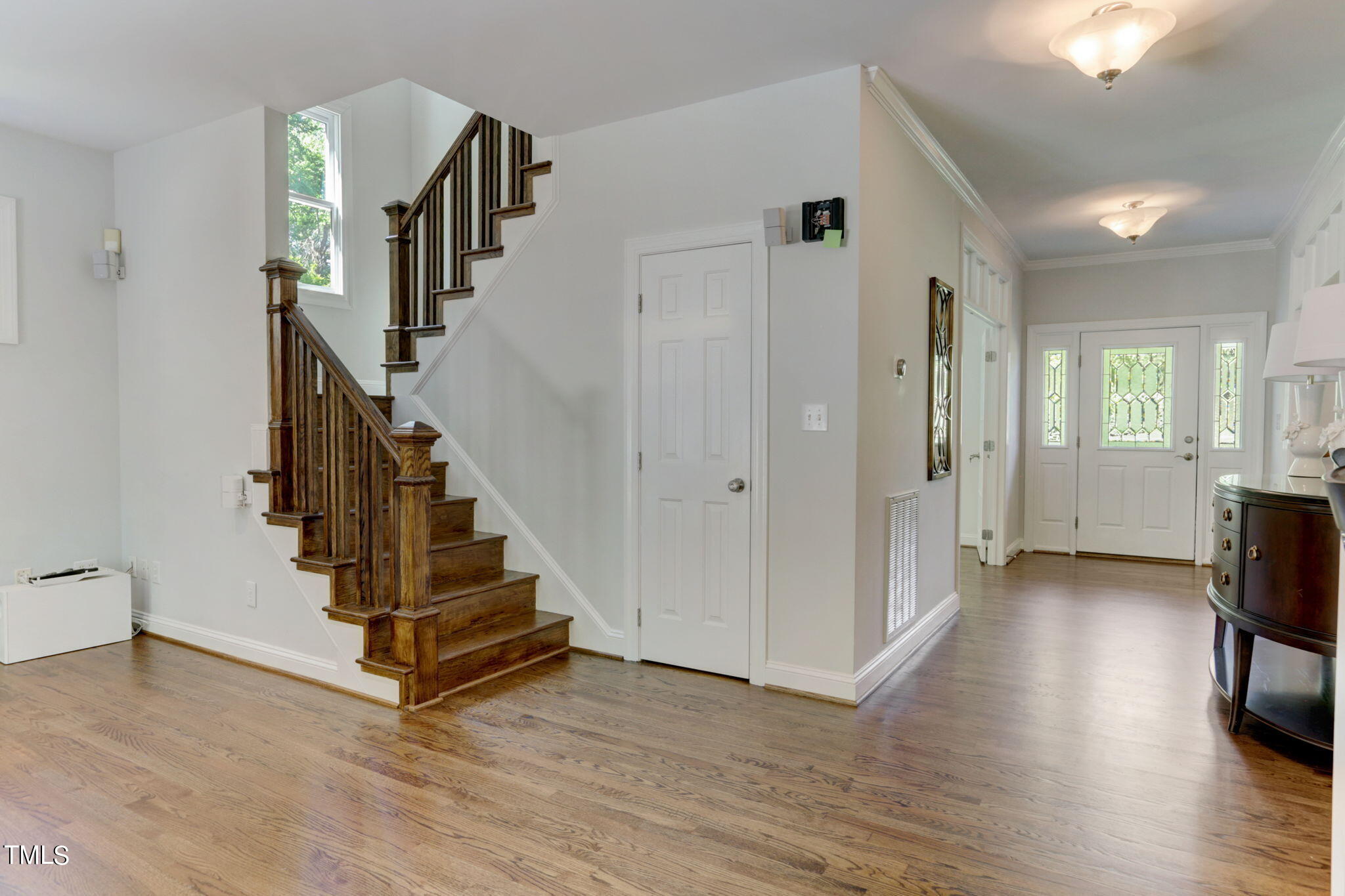 1029 Sunset Meadows Drive Apex, NC 27523 - Photo 16 of 52 a view of entryway with wooden floor and staircase