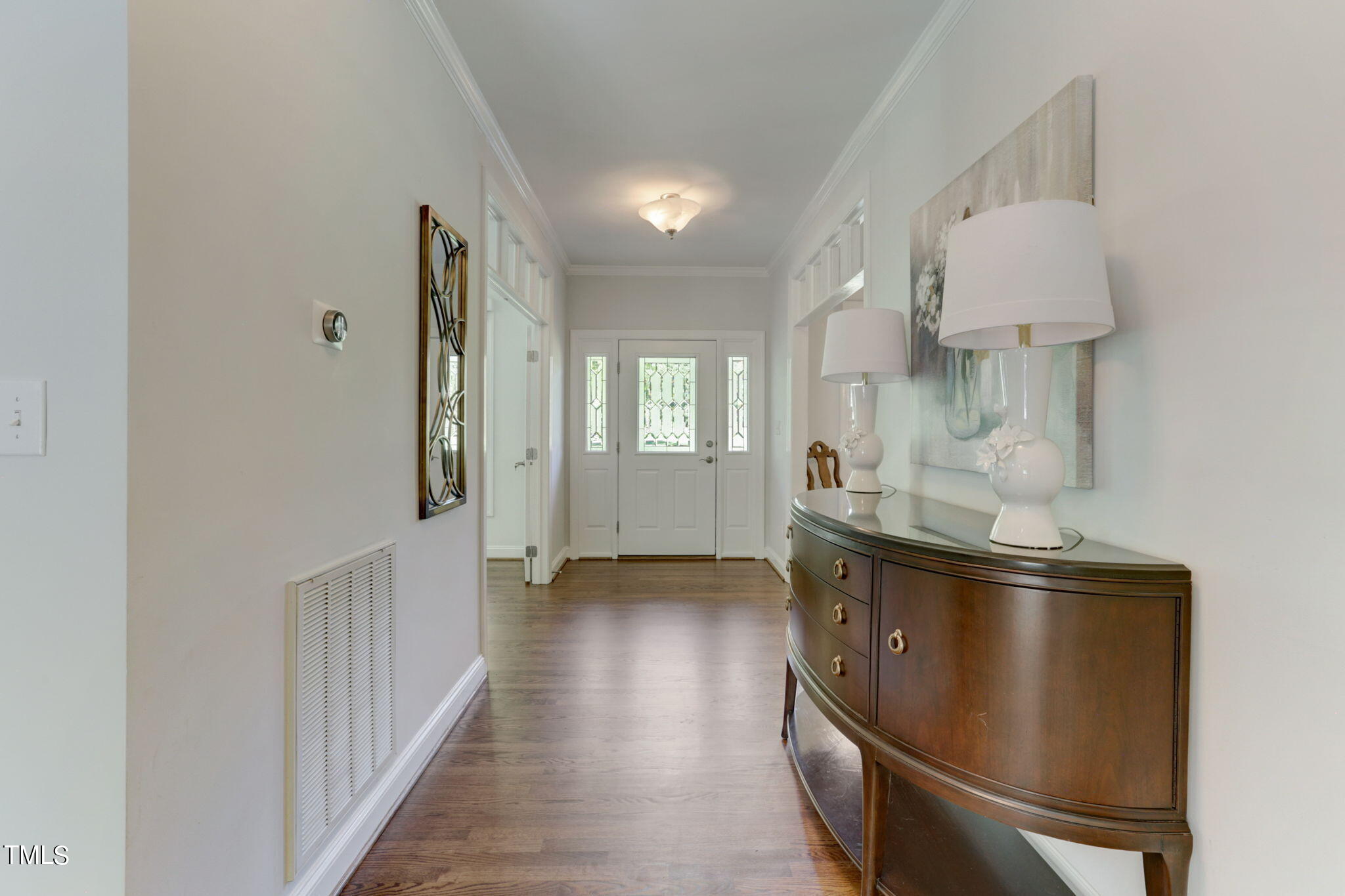 1029 Sunset Meadows Drive Apex, NC 27523 - Photo 17 of 52 a view of an empty room with wooden floor and a window