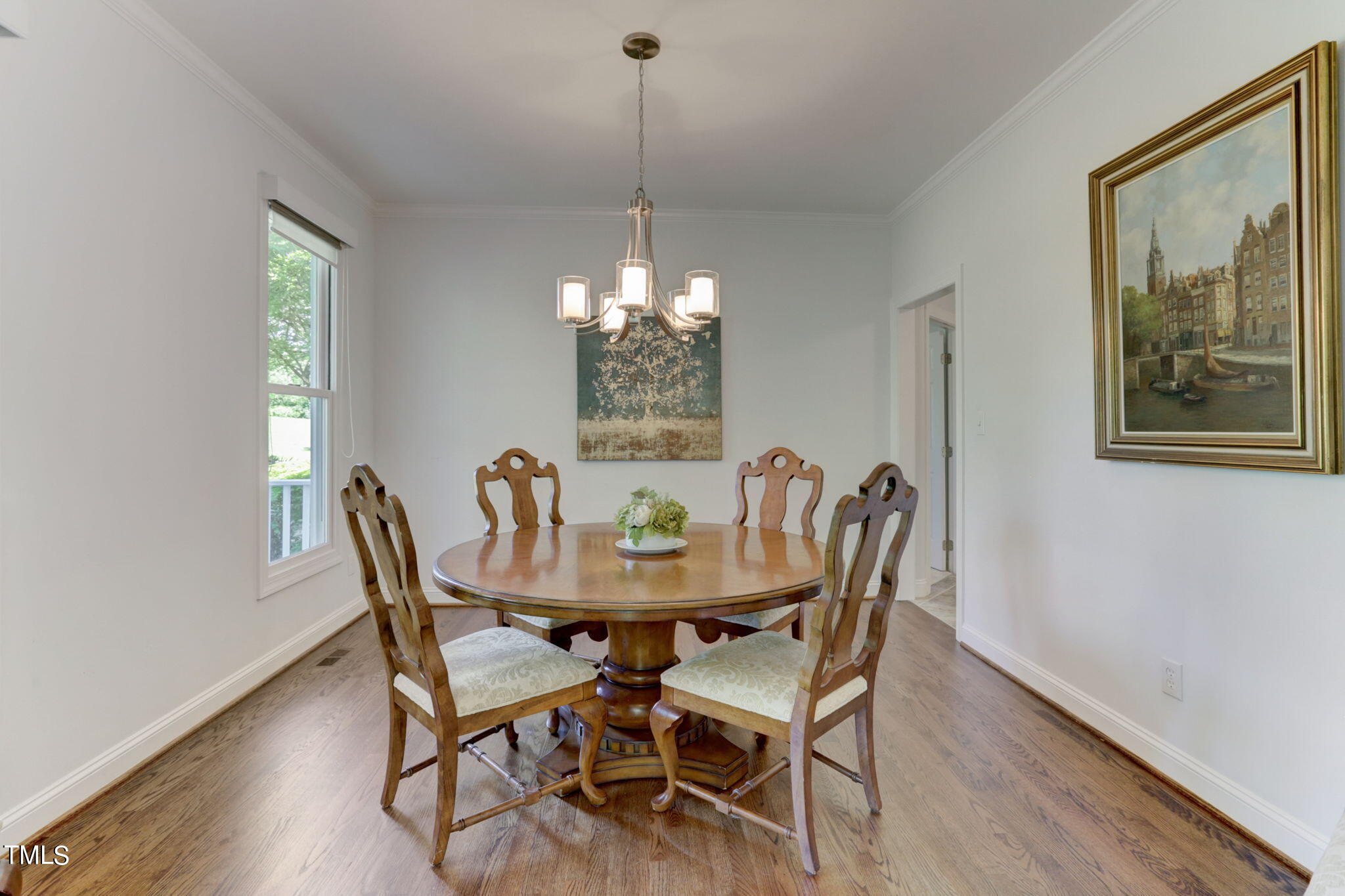 1029 Sunset Meadows Drive Apex, NC 27523 - Photo 18 of 52 a view of a dining room with furniture window and wooden floor