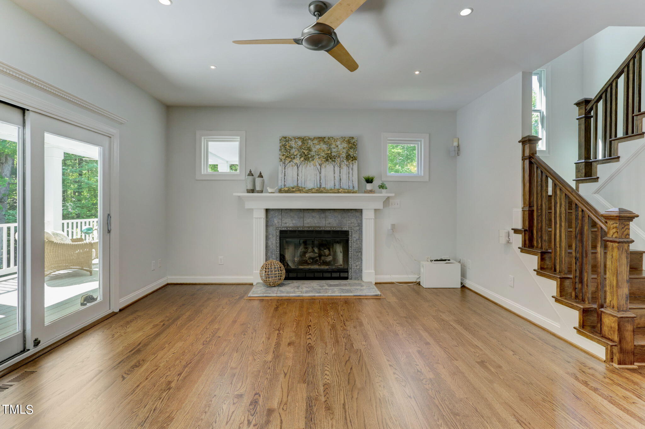 1029 Sunset Meadows Drive Apex, NC 27523 - Photo 20 of 52 a view of an empty room with wooden floor fireplace and a window