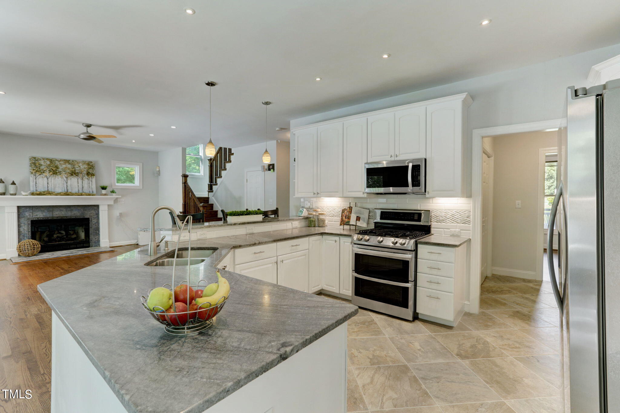 1029 Sunset Meadows Drive Apex, NC 27523 - Photo 24 of 52 a kitchen with stainless steel appliances granite countertop a sink and a stove