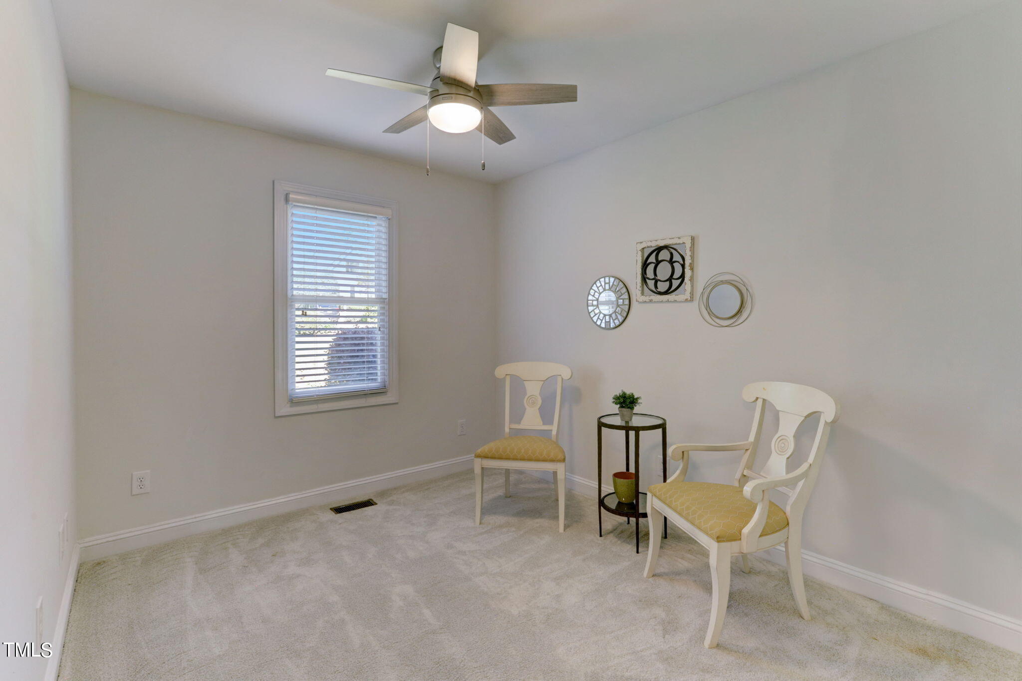 1029 Sunset Meadows Drive Apex, NC 27523 - Photo 29 of 52 a dining room with a window and furniture
