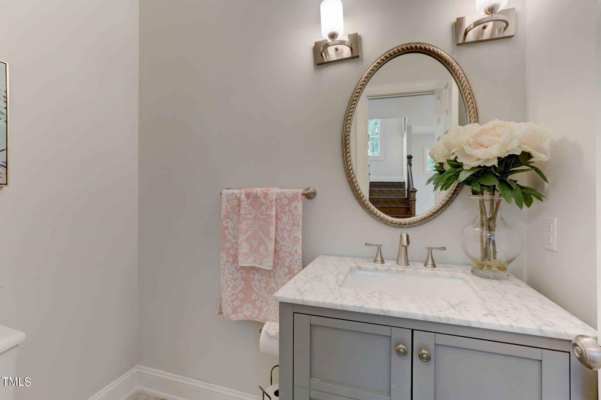1029 Sunset Meadows Drive Apex, NC 27523 - Photo 30 of 52 a bathroom with a sink and a mirror