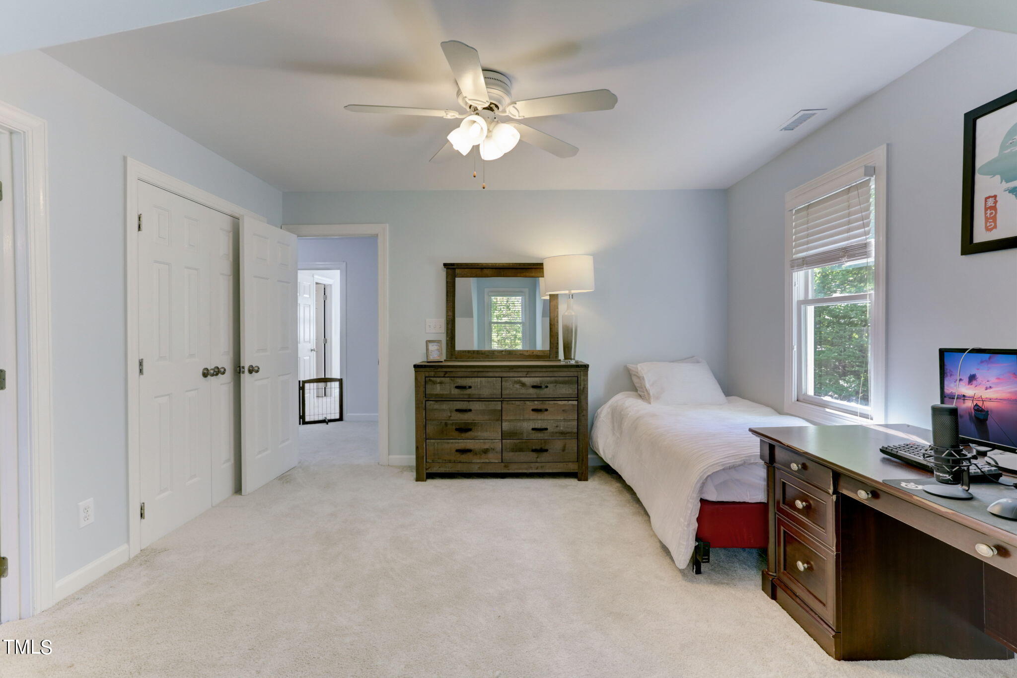 1029 Sunset Meadows Drive Apex, NC 27523 - Photo 32 of 52 a bedroom with a bed a dresser and a window