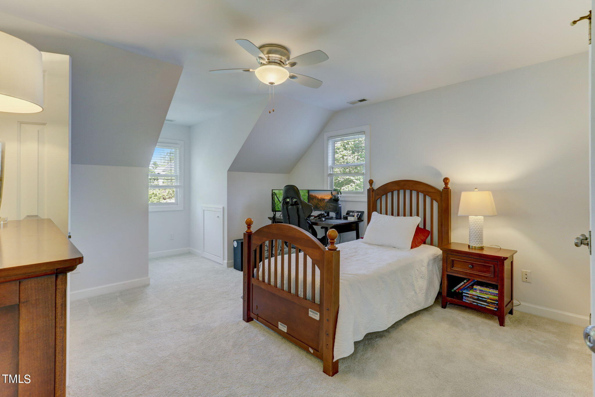 1029 Sunset Meadows Drive Apex, NC 27523 - Photo 36 of 52 a bedroom with furniture and a chandelier