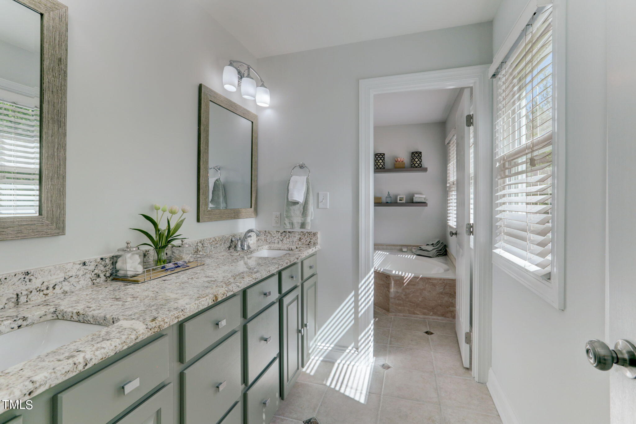 1029 Sunset Meadows Drive Apex, NC 27523 - Photo 40 of 52 a bathroom with a granite countertop sink and a mirror