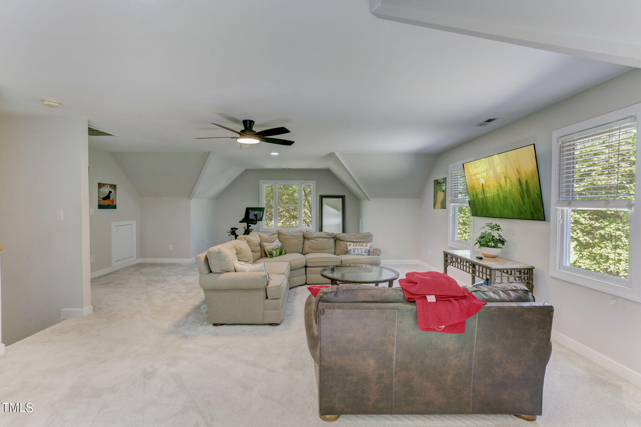 1029 Sunset Meadows Drive Apex, NC 27523 - Photo 45 of 52 a living room with furniture and a flat screen tv