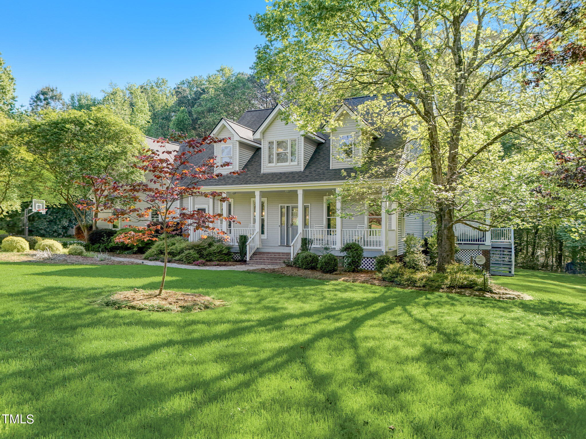 1029 Sunset Meadows Drive Apex, NC 27523 - Photo 48 of 52 a front view of a house with a yard and trees