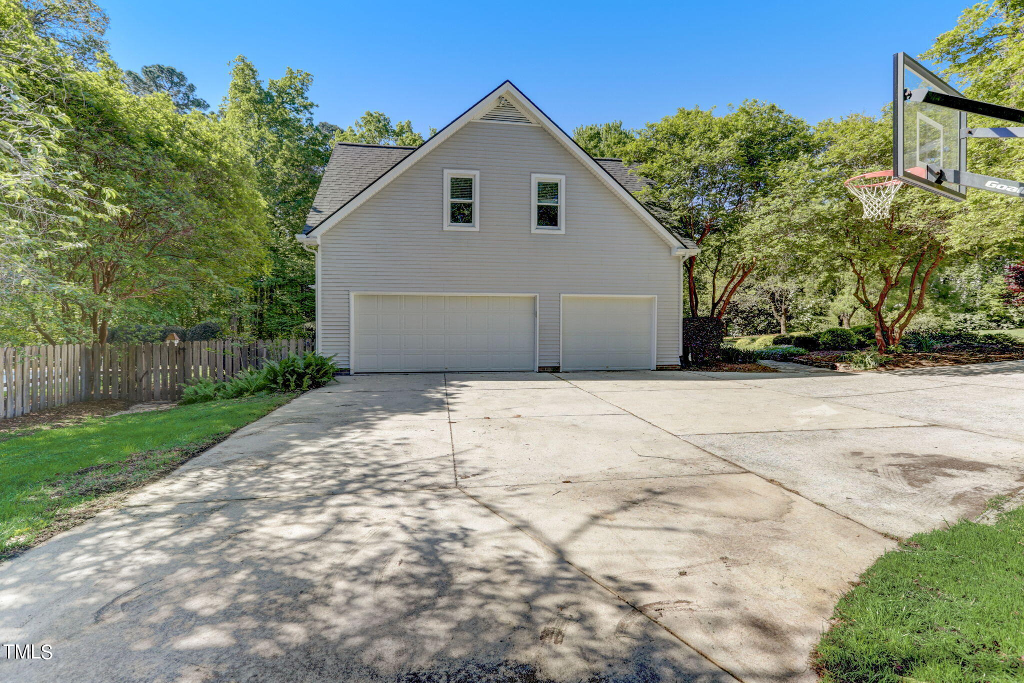 1029 Sunset Meadows Drive Apex, NC 27523 - Photo 50 of 52 a view of garage yard and tree