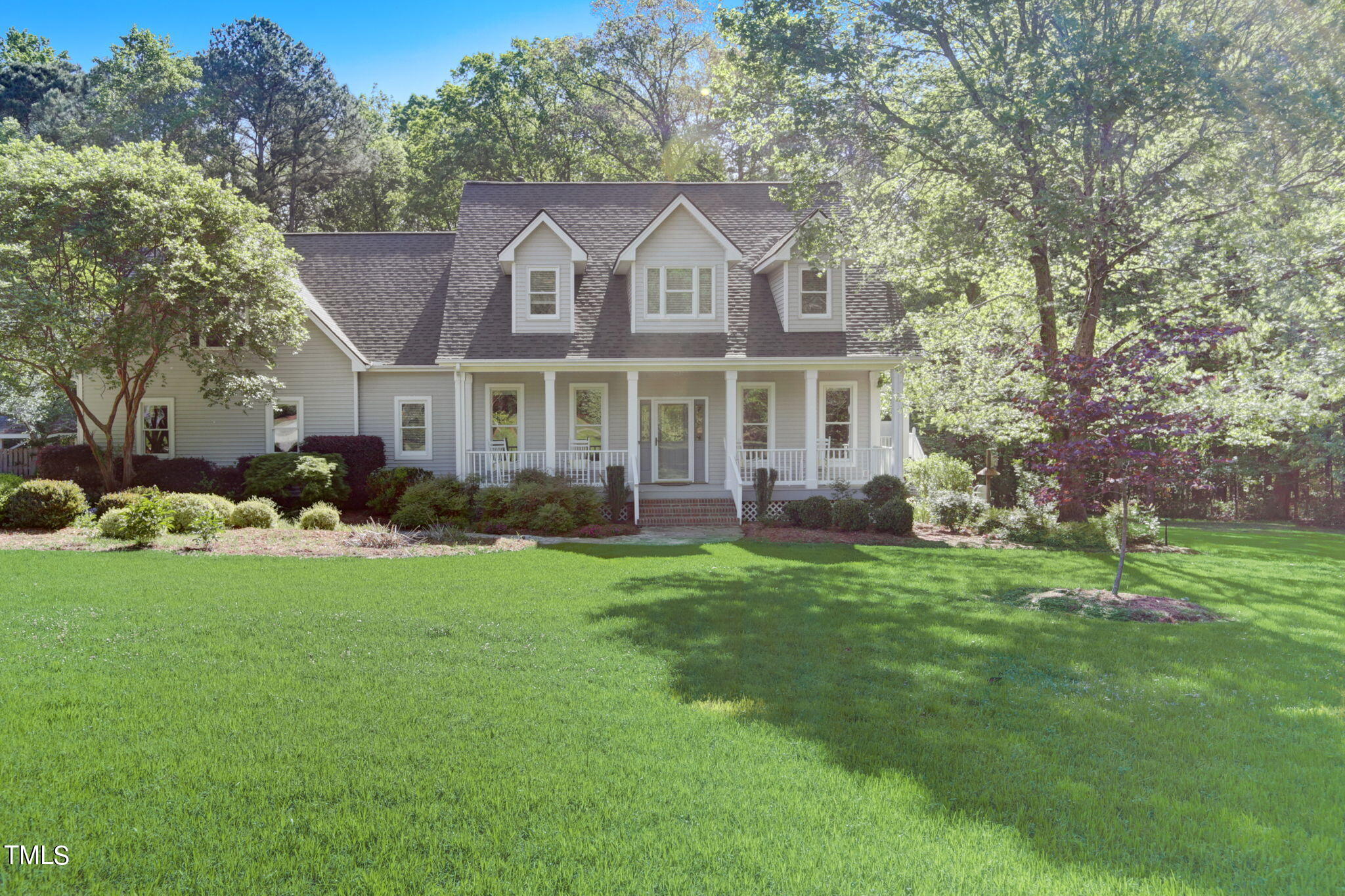 1029 Sunset Meadows Drive Apex, NC 27523 - Photo 9 of 52 a front view of a house with a garden