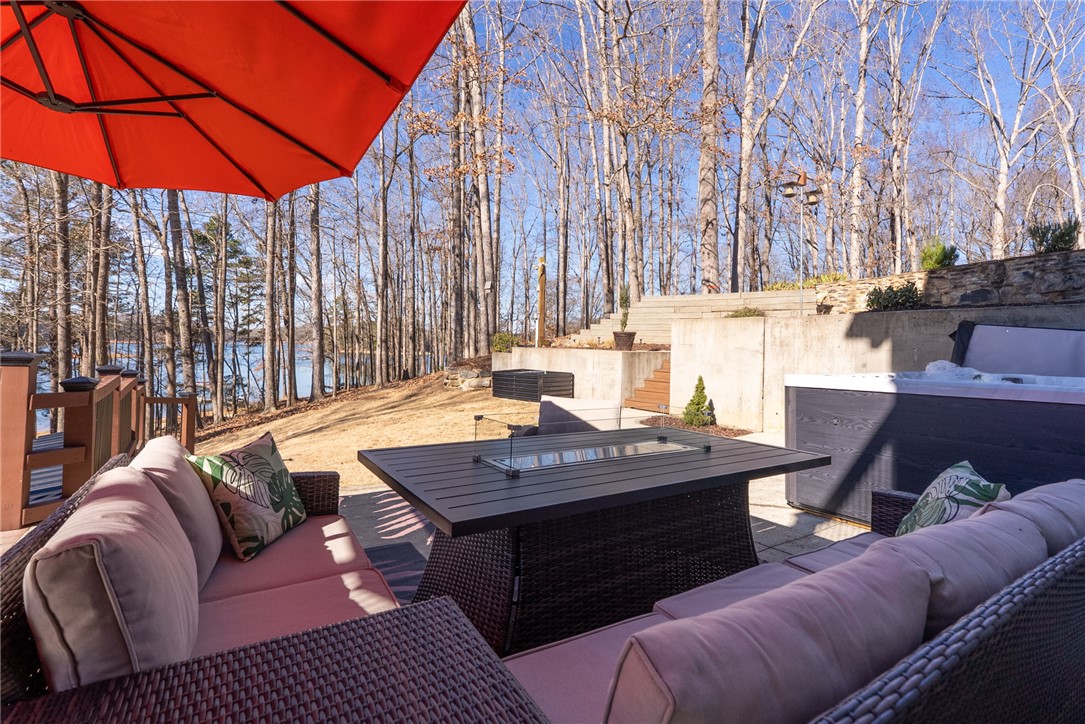 505 Northview Court Fair Play, SC 29643 - Photo 13 of 48 This inviting patio offers a tranquil lakeside escape, perfect for relaxation and enjoying the natural surroundings.